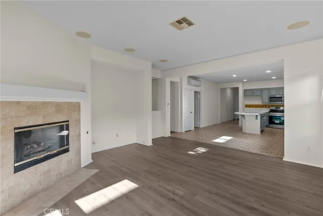 a view of a kitchen with furniture and a fireplace