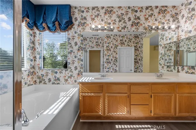 a bathroom with a bathtub and a sink