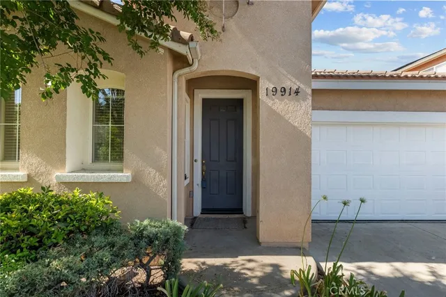 front view of a house with a small yard