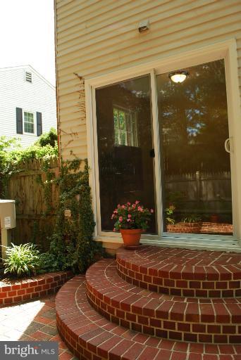 8571 Tyrolean Way Springfield, VA 22153 - Photo 6 of 22 Exterior (Rear)WALK OUT TO PATIO FROM KIT.