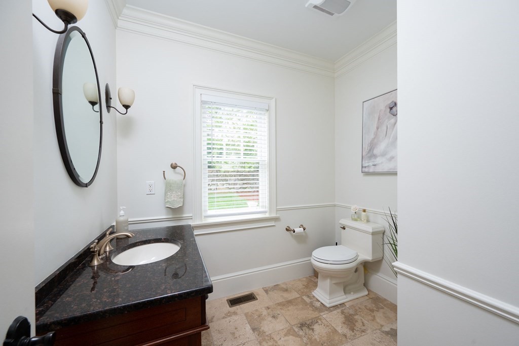 6 High Meadow Road Andover, MA 01810 - Photo 16 of 32 a bathroom with a sink toilet a mirror and a tub