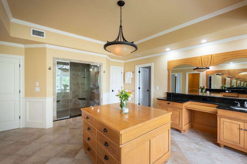 6 High Meadow Road Andover, MA 01810 - Photo 20 of 32 a kitchen with stainless steel appliances granite countertop a sink and stove