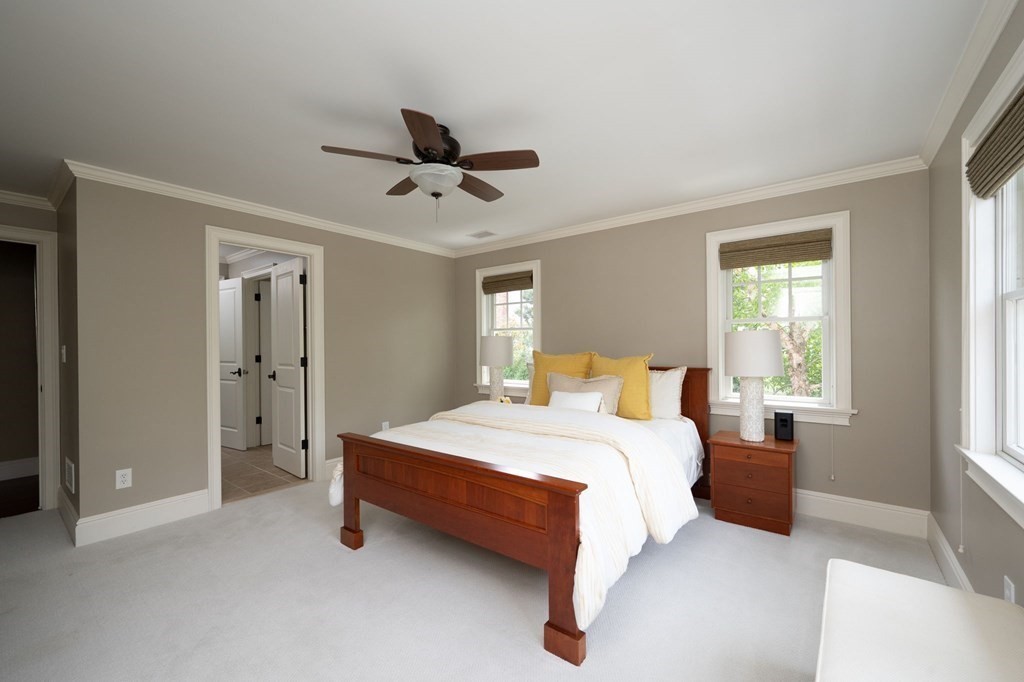 6 High Meadow Road Andover, MA 01810 - Photo 22 of 32 a spacious bedroom with a bed and a window