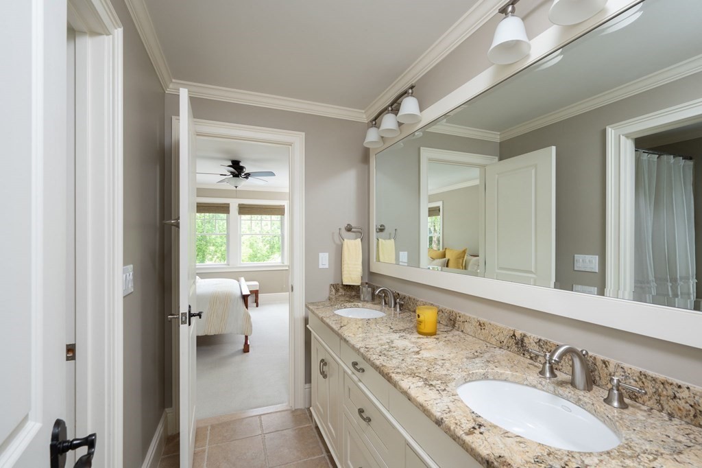 6 High Meadow Road Andover, MA 01810 - Photo 23 of 32 a spacious bathroom with a granite countertop double vanity sink a mirror and a