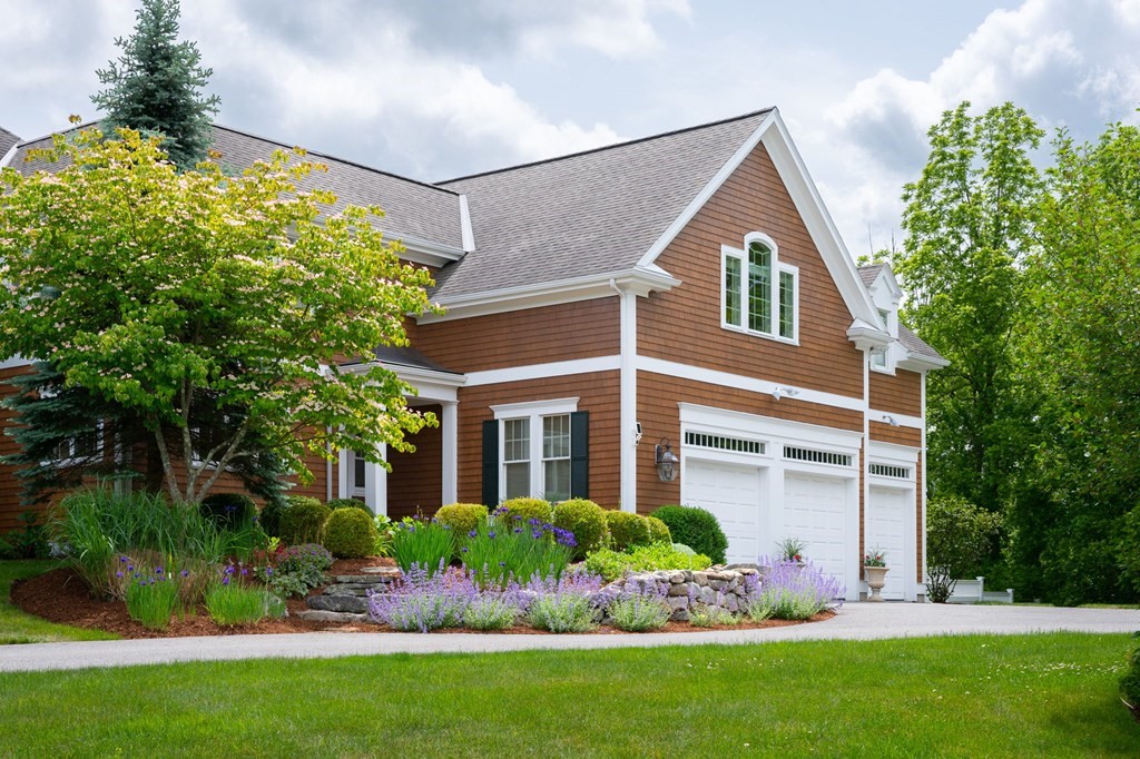 6 High Meadow Road Andover, MA 01810 - Photo 32 of 32 a front view of a house with a yard and potted plants