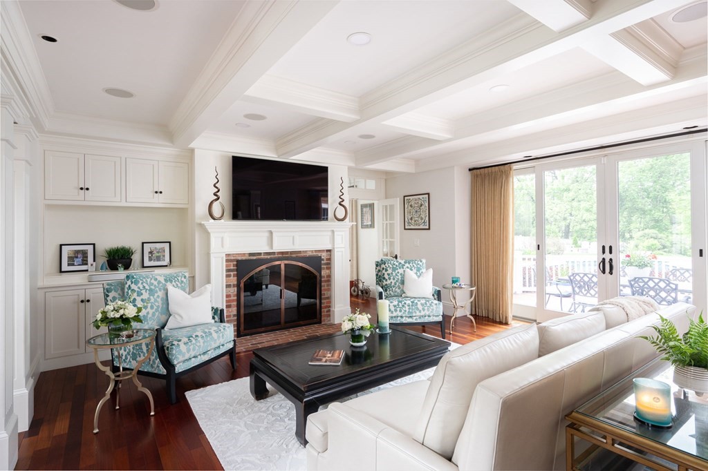 6 High Meadow Road Andover, MA 01810 - Photo 5 of 32 a living room with furniture a fireplace and a flat screen tv