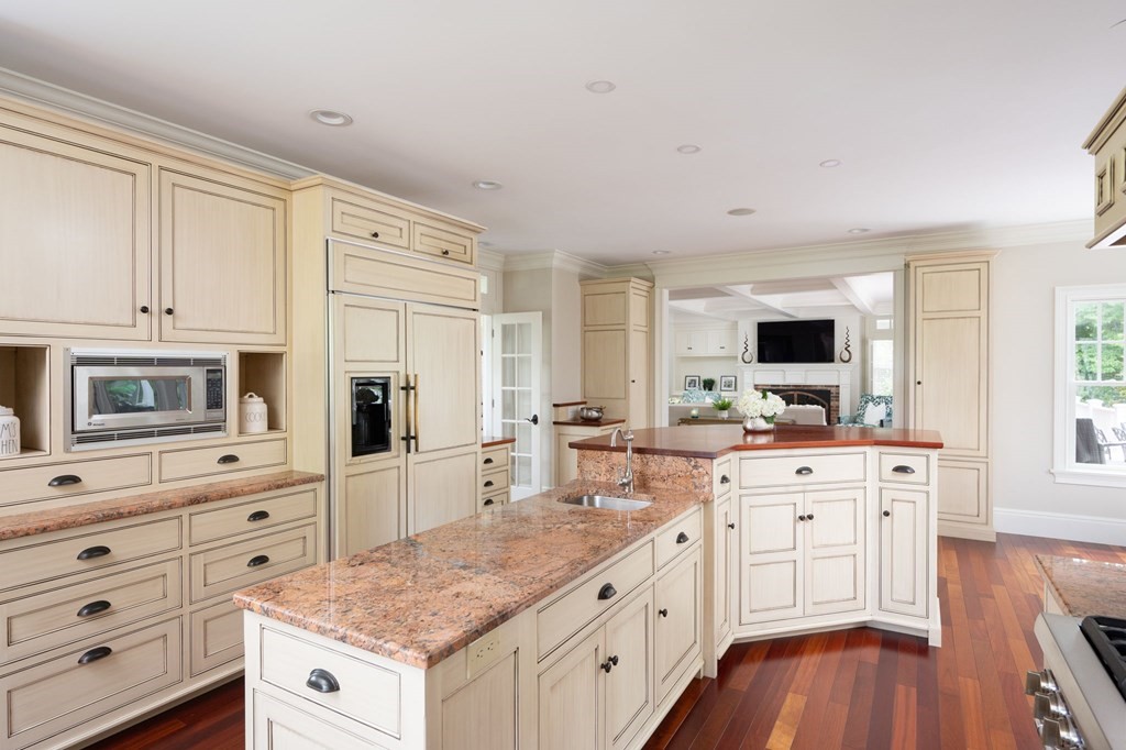 6 High Meadow Road Andover, MA 01810 - Photo 10 of 32 a kitchen with granite countertop white cabinets and white appliances