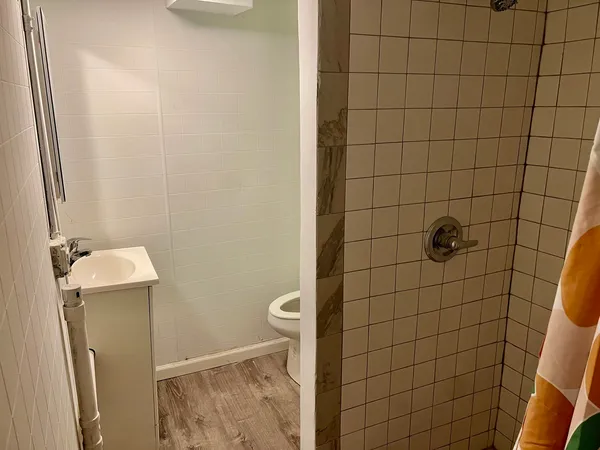 a bathroom with a sink and toilet