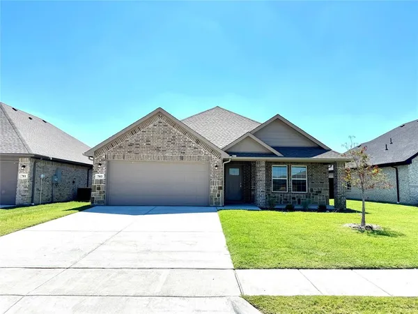 a view of a house with a yard and a porch