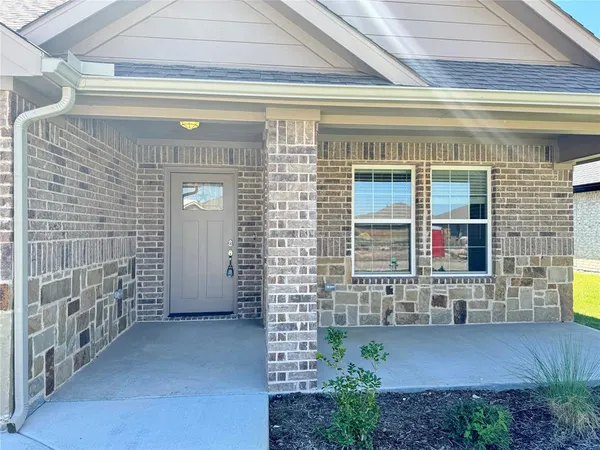 a view of front door of house with a window