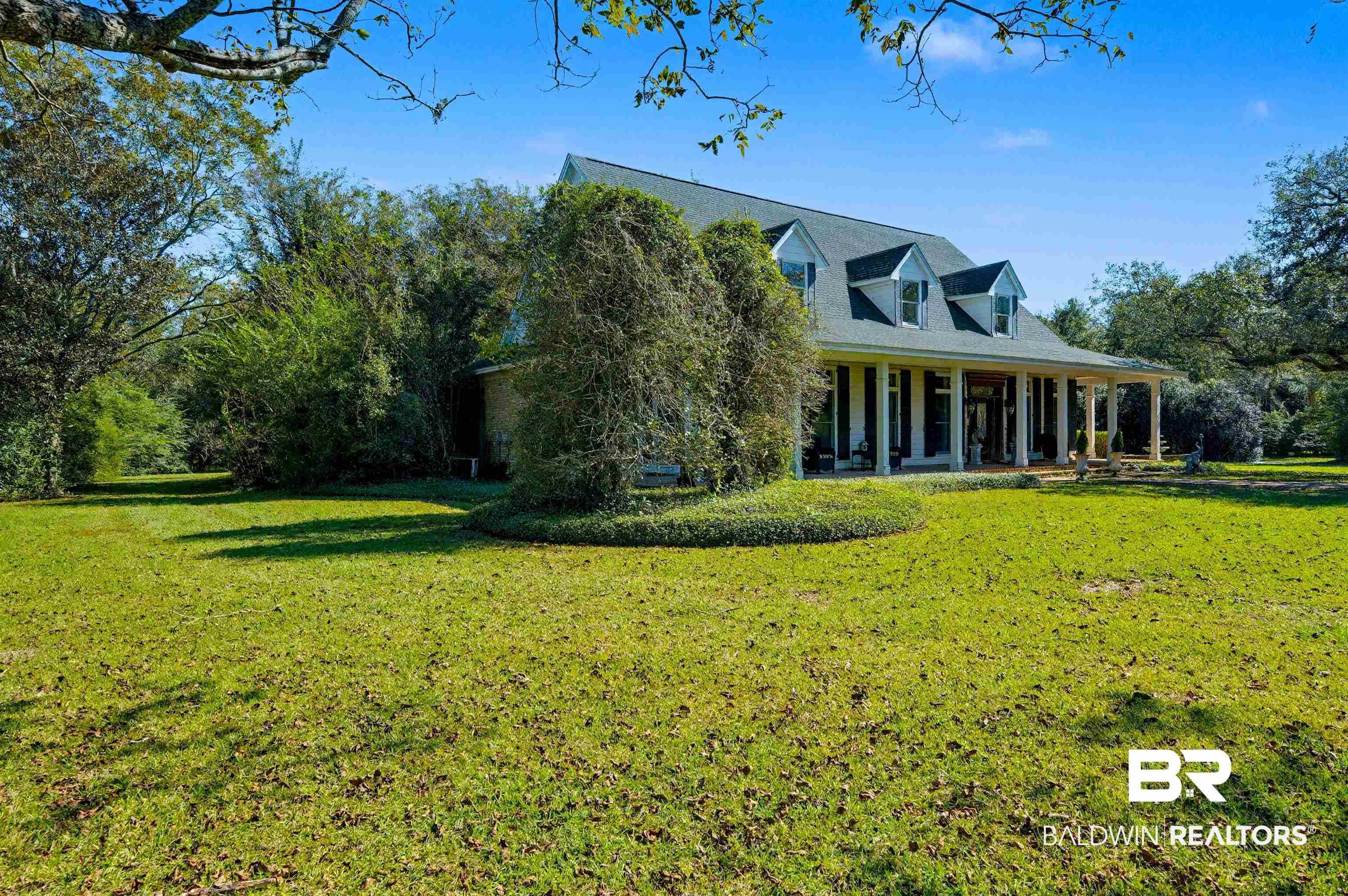 15810 County Road 73 Foley, AL 36535 - Photo 5 of 56 Back of house featuring a porch and a yard