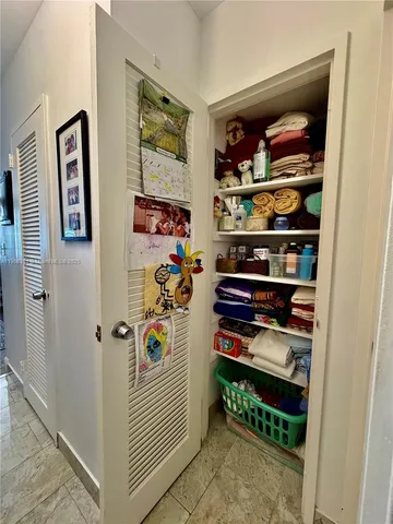 a room with gym equipment and a large window