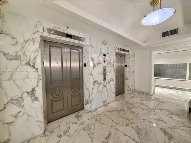 a view of a swimming pool with outdoor seating and plants