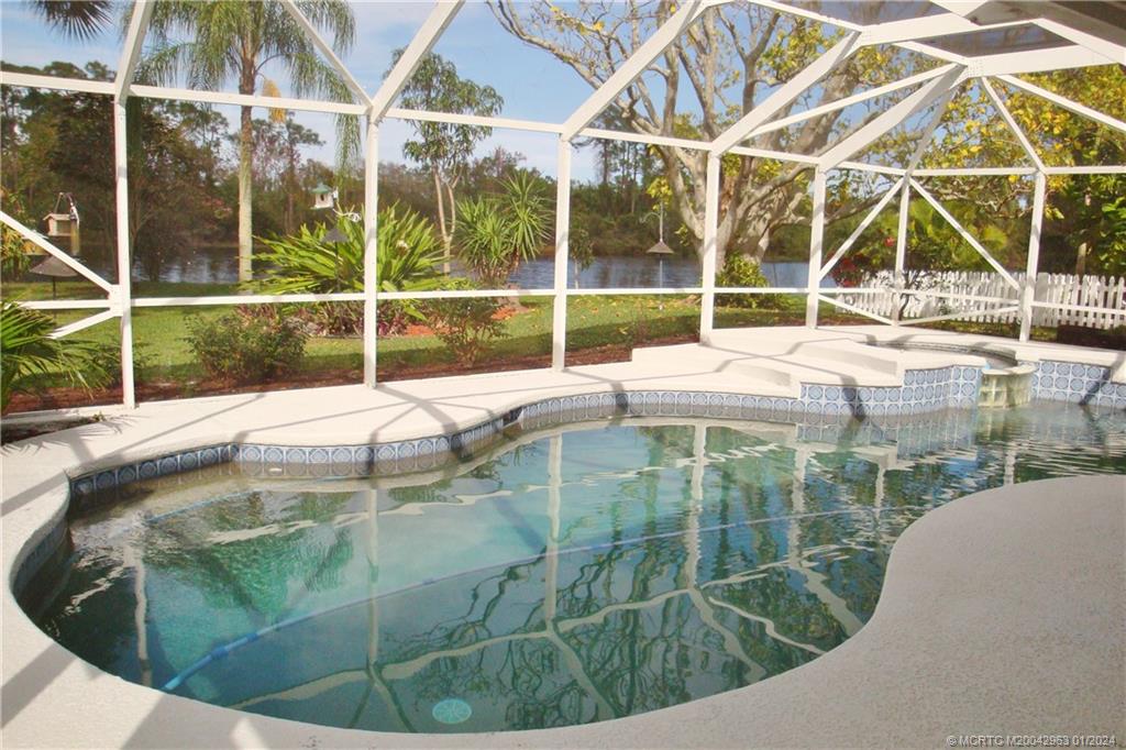2209 Southwest Oak Ridge Road Palm City, FL 34990 - Photo 6 of 35 Pool with pond view
