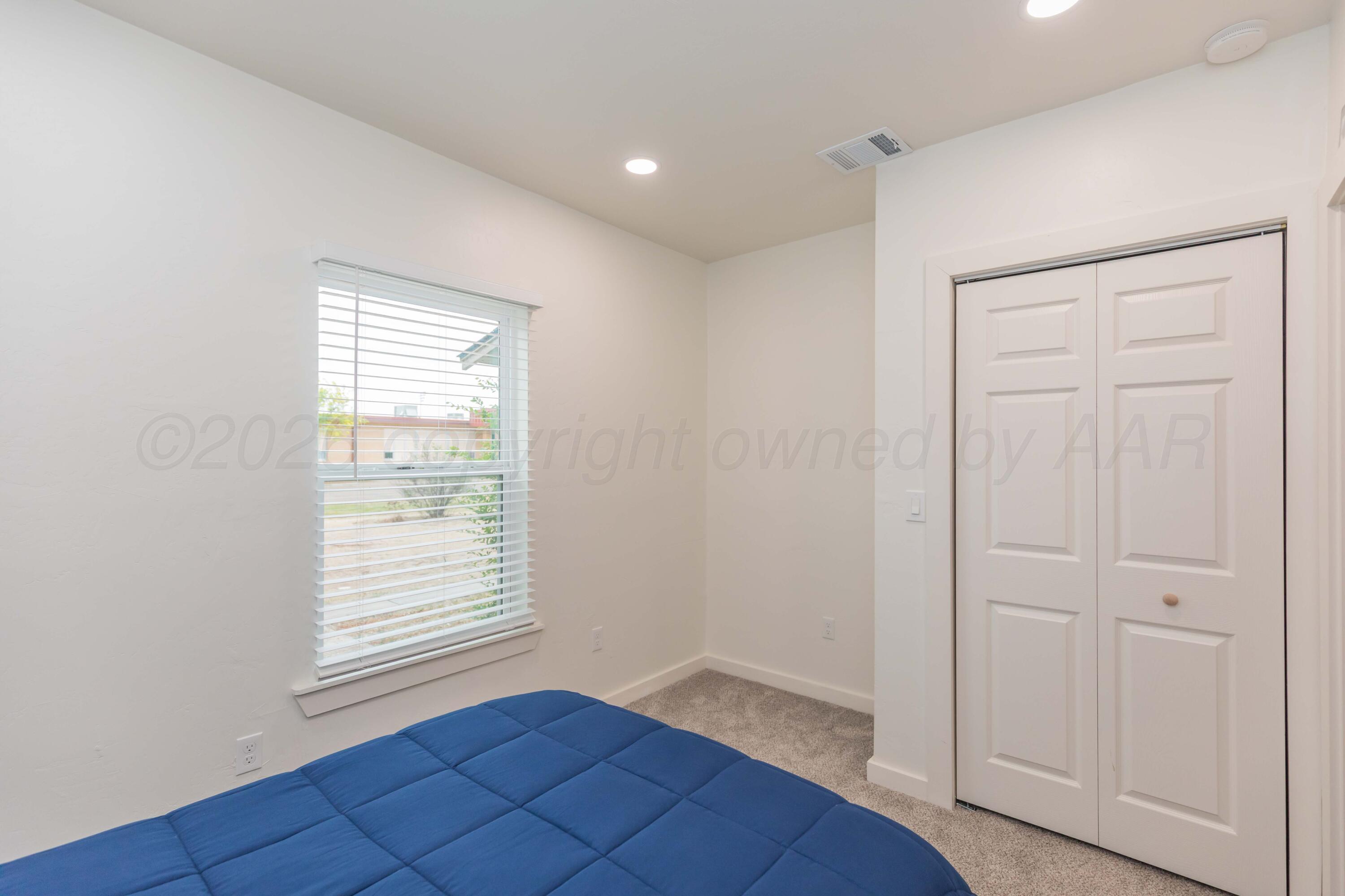 504 High Street Claude, TX 79019 - Photo 12 of 39 an empty room with windows
