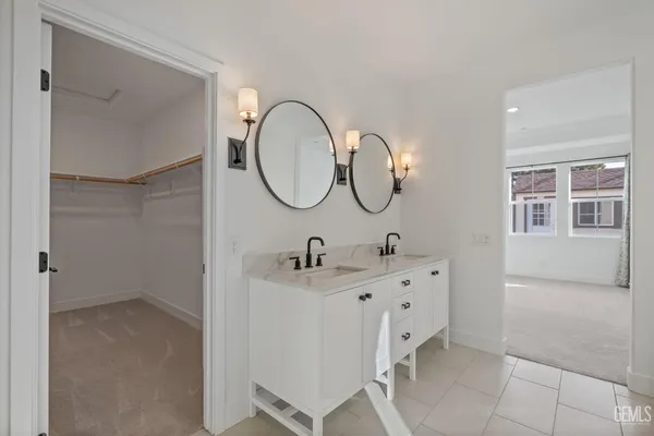 a bathroom with a sink and mirror