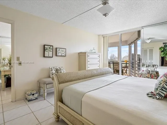 a bedroom with a bed and a table