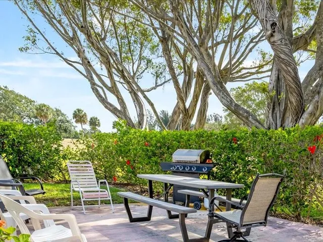 a view of backyard with seating space