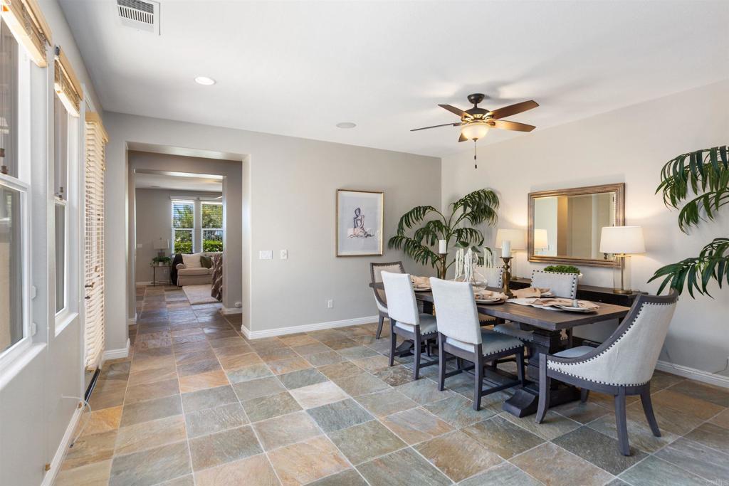 1415 Eclipse Drive San Marcos, CA 92078 - Photo 18 of 57 a view of a dining room with furniture and a chandelier