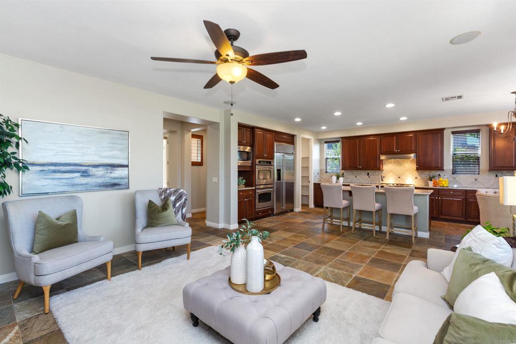 1415 Eclipse Drive San Marcos, CA 92078 - Photo 24 of 57 a living room with furniture and kitchen view