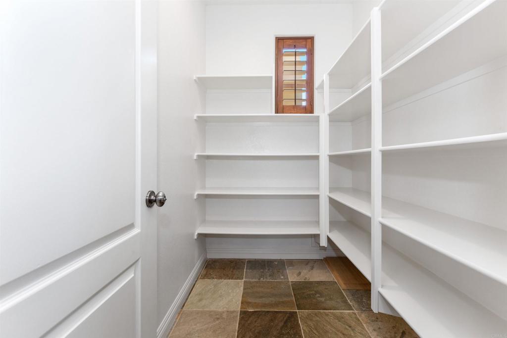 1415 Eclipse Drive San Marcos, CA 92078 - Photo 28 of 57 a view of walk in closet with empty racks