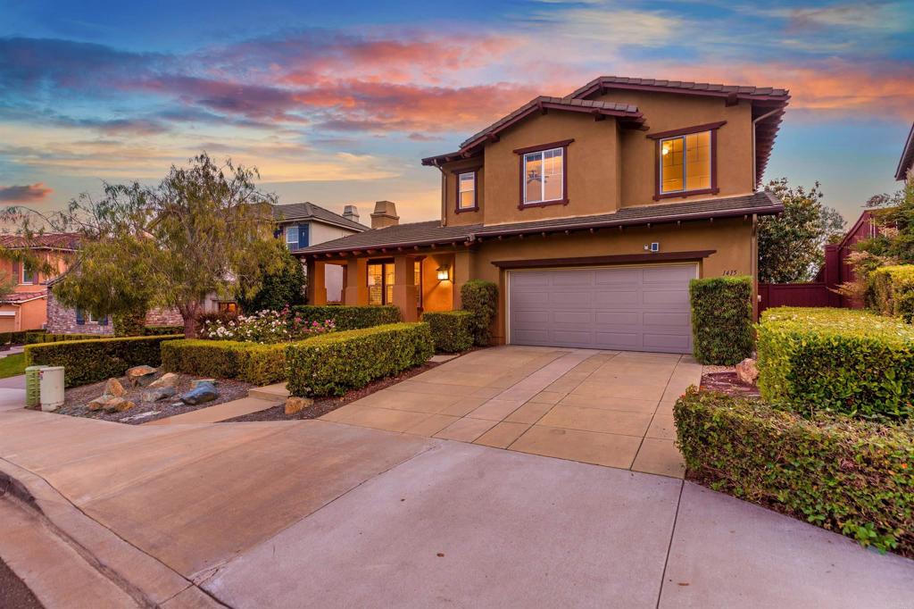 1415 Eclipse Drive San Marcos, CA 92078 - Photo 3 of 57 a front view of a house with a yard and garage