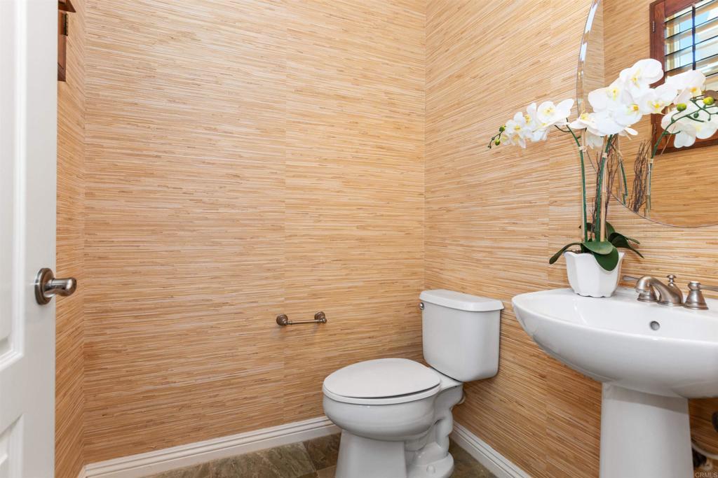 1415 Eclipse Drive San Marcos, CA 92078 - Photo 31 of 57 a bathroom with a sink a toilet and mirror