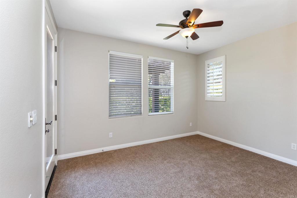 1415 Eclipse Drive San Marcos, CA 92078 - Photo 32 of 57 a view of a livingroom with a window and a ceiling fan
