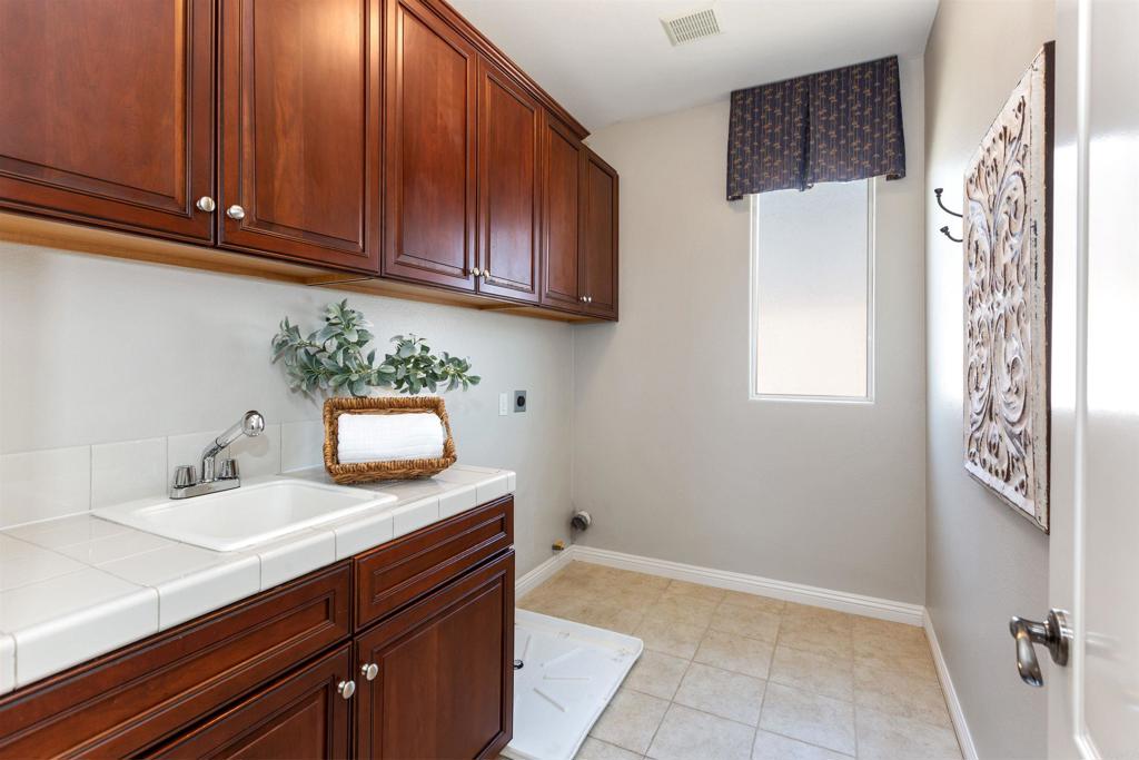 1415 Eclipse Drive San Marcos, CA 92078 - Photo 36 of 57 a bathroom with a sink and a mirror