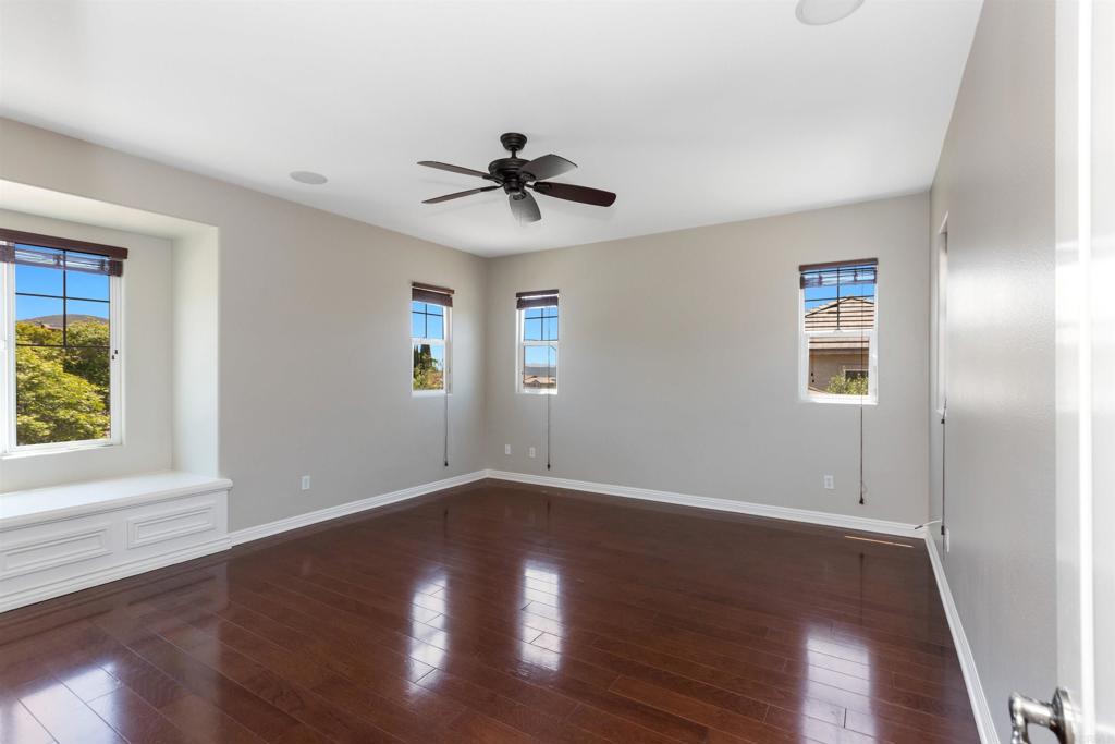 1415 Eclipse Drive San Marcos, CA 92078 - Photo 48 of 57 a view of empty room with wooden floor and fan
