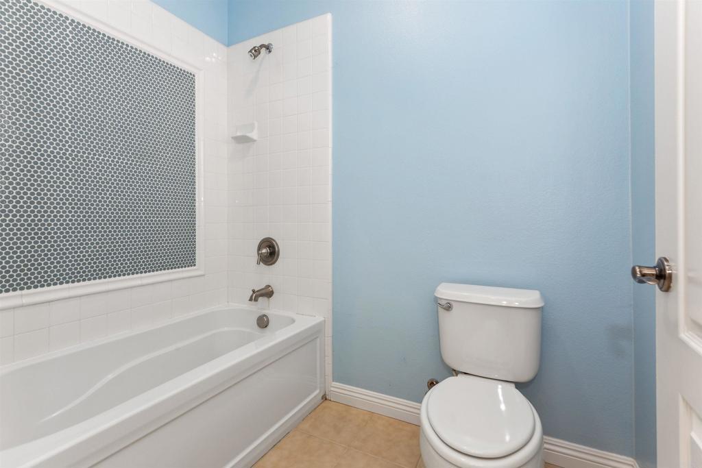 1415 Eclipse Drive San Marcos, CA 92078 - Photo 50 of 57 a white toilet sitting next to a bath tub