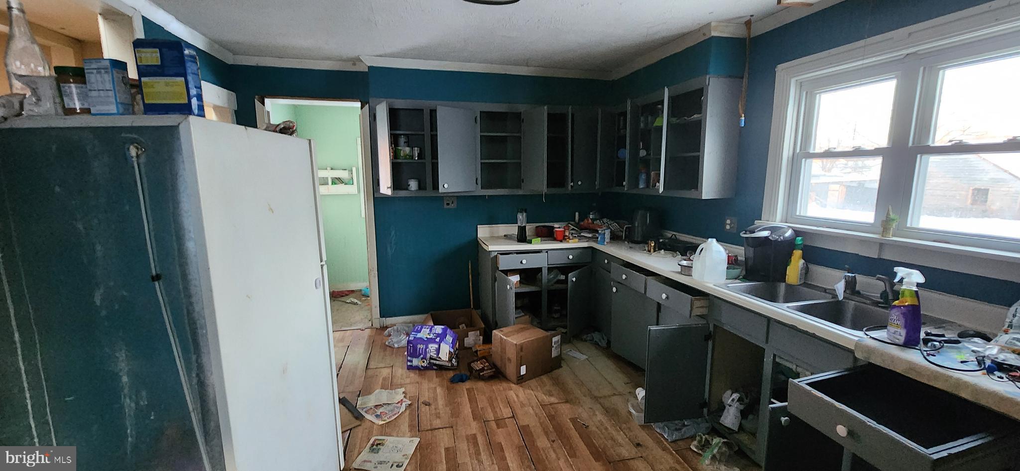 3250 Big Spring Road Blain, PA 17006 - Photo 12 of 20 a kitchen with a refrigerator and a stove top oven
