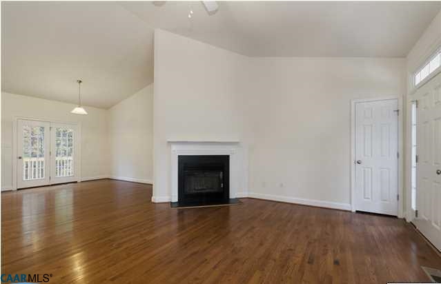 1978 Miller School Road Charlottesville, VA 22903 - Photo 7 of 18 an empty room with wooden floor and fireplace