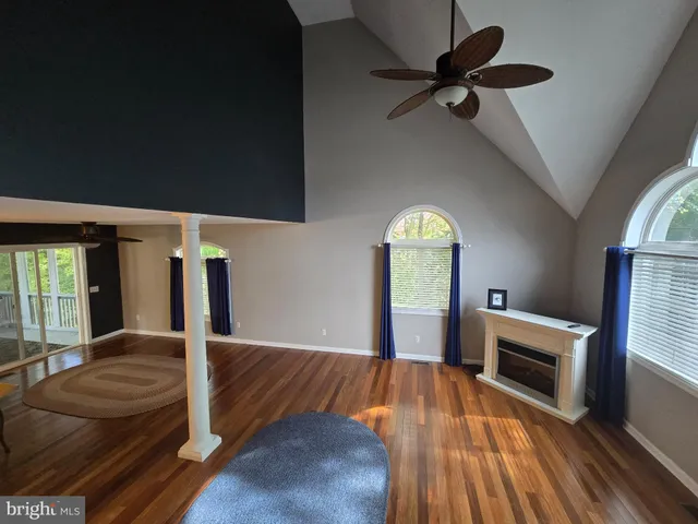 a view of a livingroom with furniture and a window