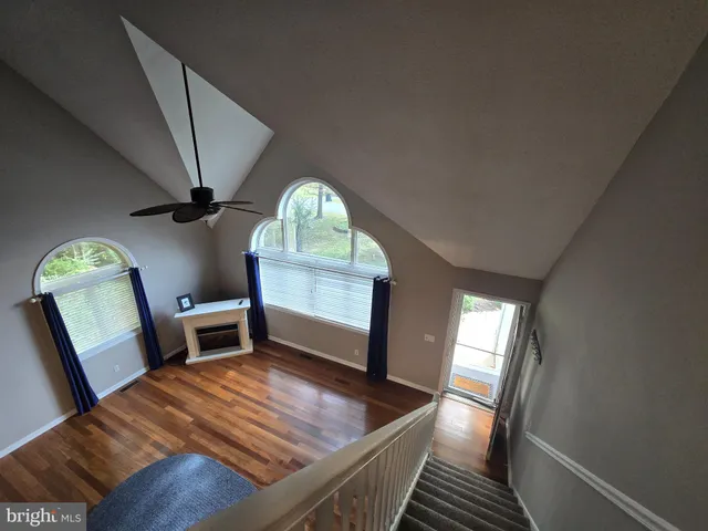 a kitchen with a dining table chairs and chandelier