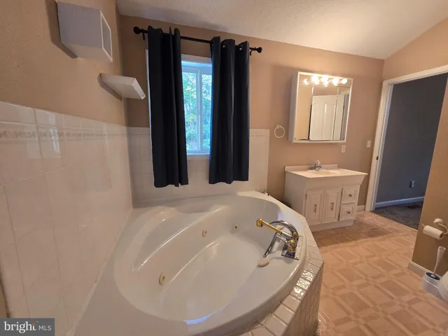 a view of backyard with outdoor seating and trees