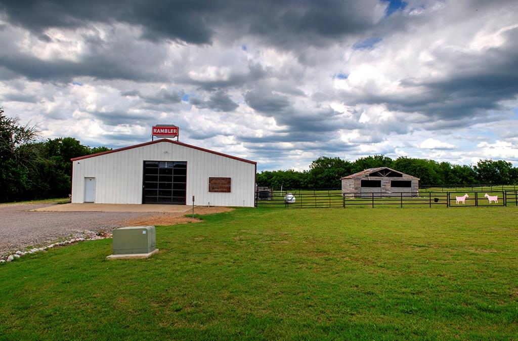 a front view of a house with yard and green space