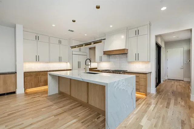 a kitchen with a stove and a sink