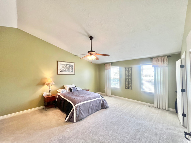 369 Culross Circle Tooele, UT 84074 - Photo 22 of 54 Expansive room with vaulted ceilings and wall-to-wall carpeting