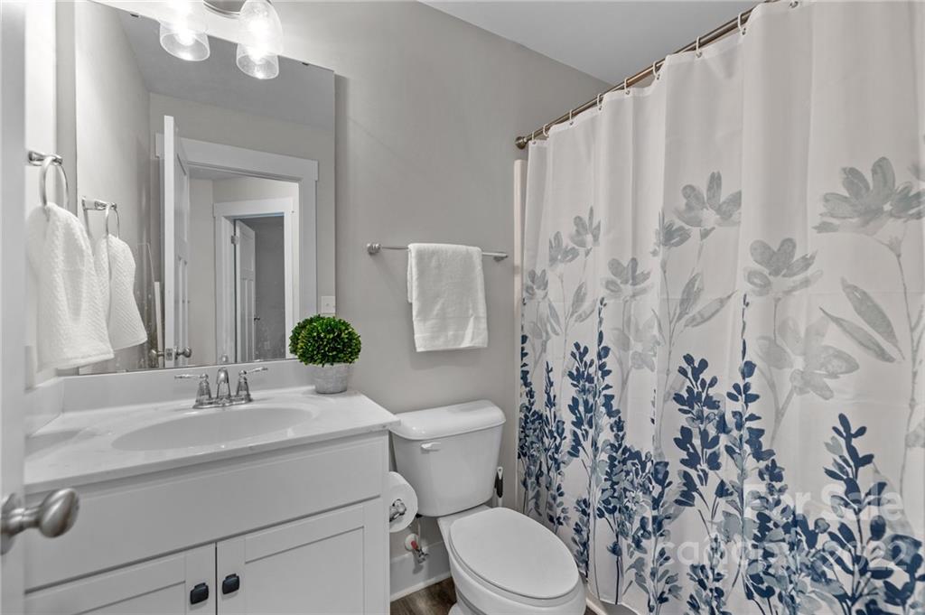 30 Rose Street York, SC 29745 - Photo 18 of 31 a bathroom with a toilet a sink and a mirror