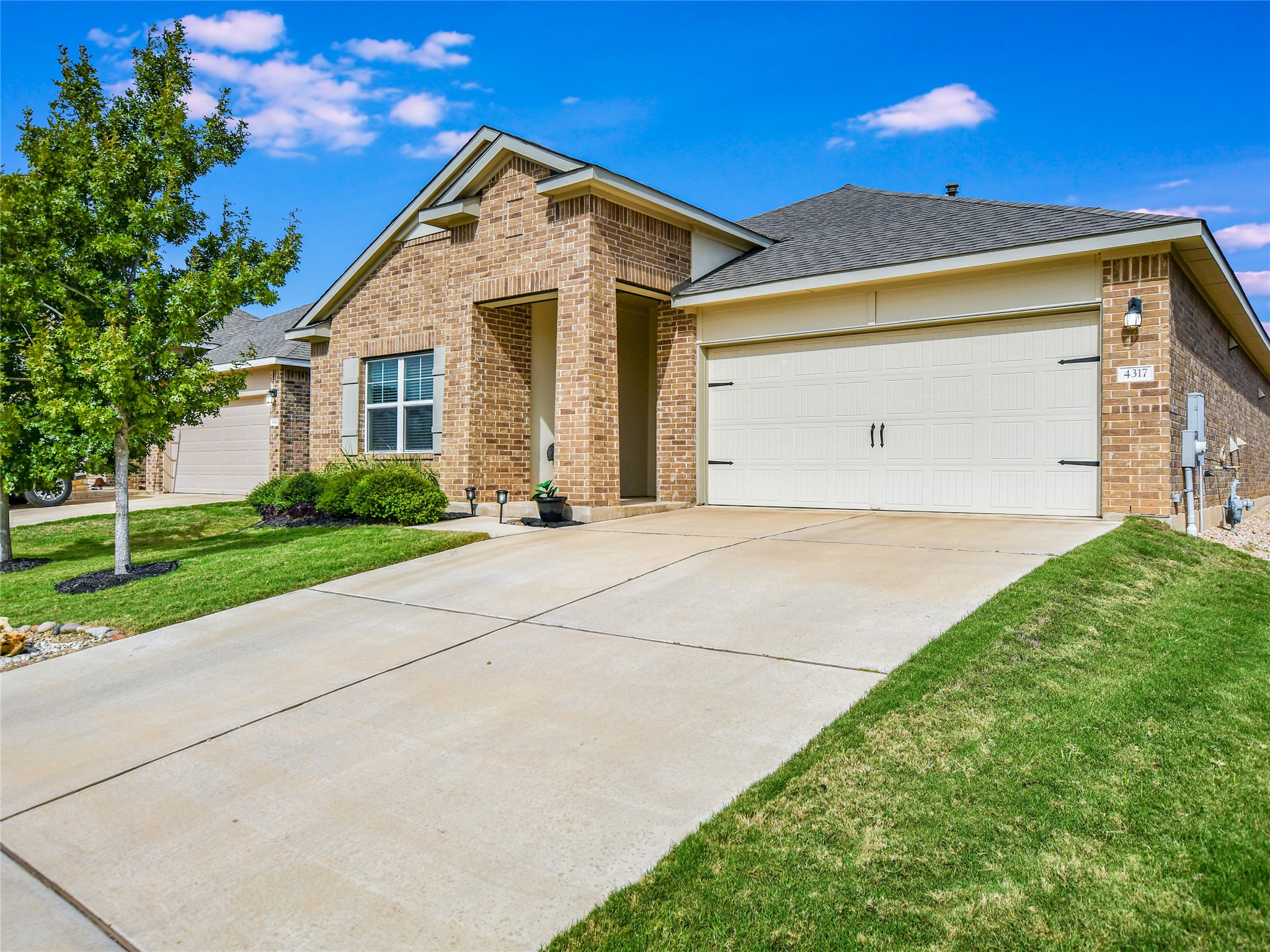 4317 Buffalo Ford Road Georgetown, TX 78628 - Photo 2 of 37 Beautiful Curb Appeal- DR Horton Home built in 2018. Note trees will be trimmed on Saturday and existing landscaping will be cleaned up.