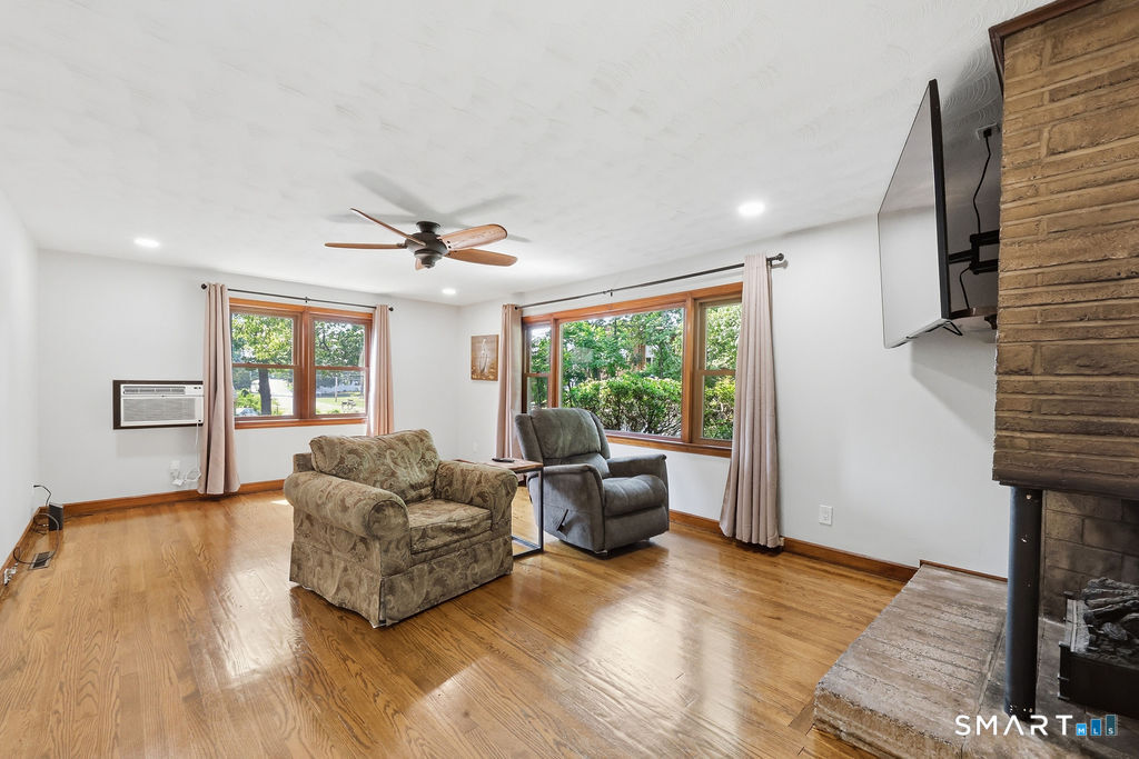 630 South Elm Street Wallingford, CT 06492 - Photo 11 of 30 a living room with furniture and a window
