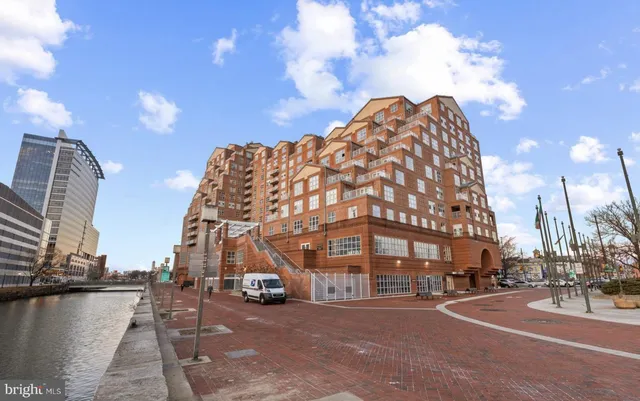 a bed room with a bed and a large window