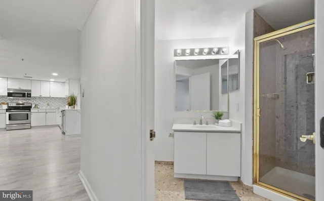 a bathroom with a sink and shower