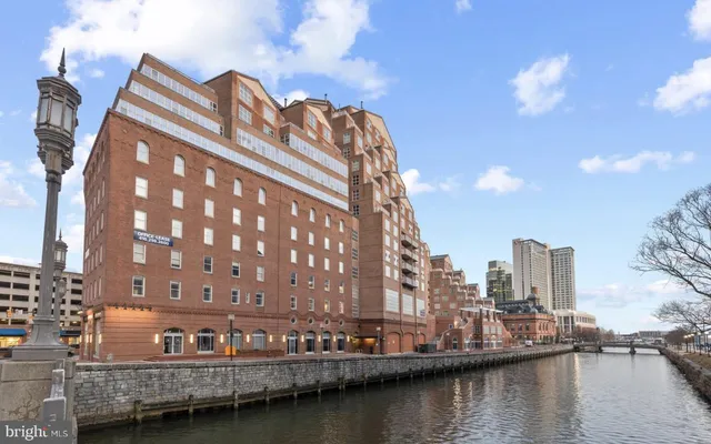 a hallway with a table and chairs