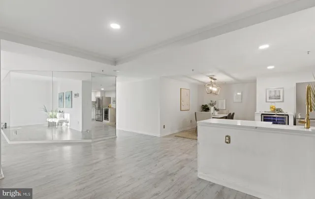 a view of kitchen with microwave and cabinets