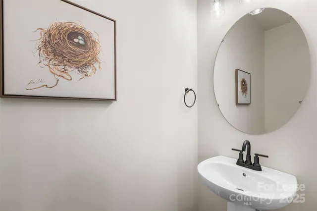 a bathroom with a sink and mirror