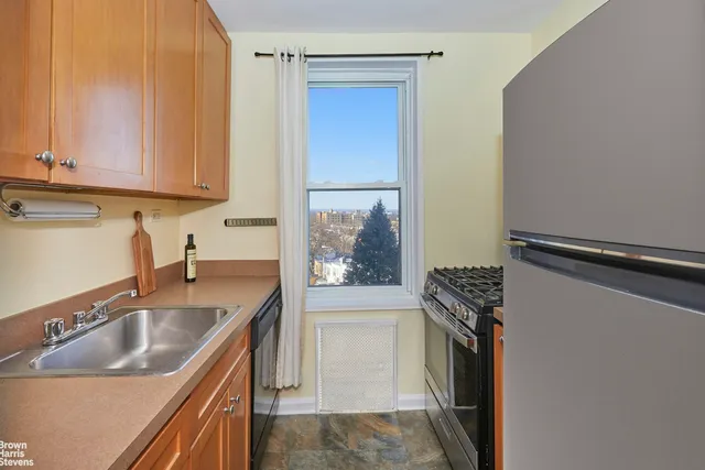 a view of a livingroom with wooden floor and furniture