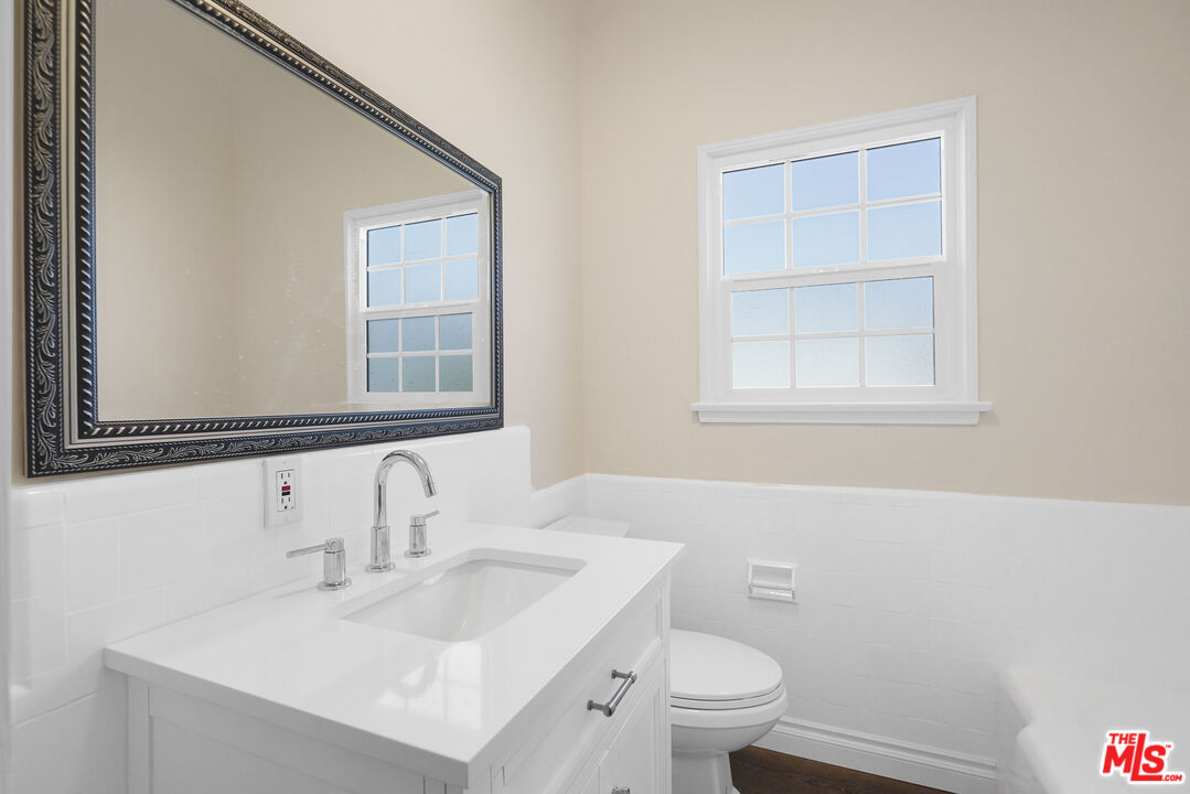 228 South Reeves Drive, Unit D Beverly Hills, CA 90212 - Photo 11 of 13 a bathroom with a sink and a toilet
