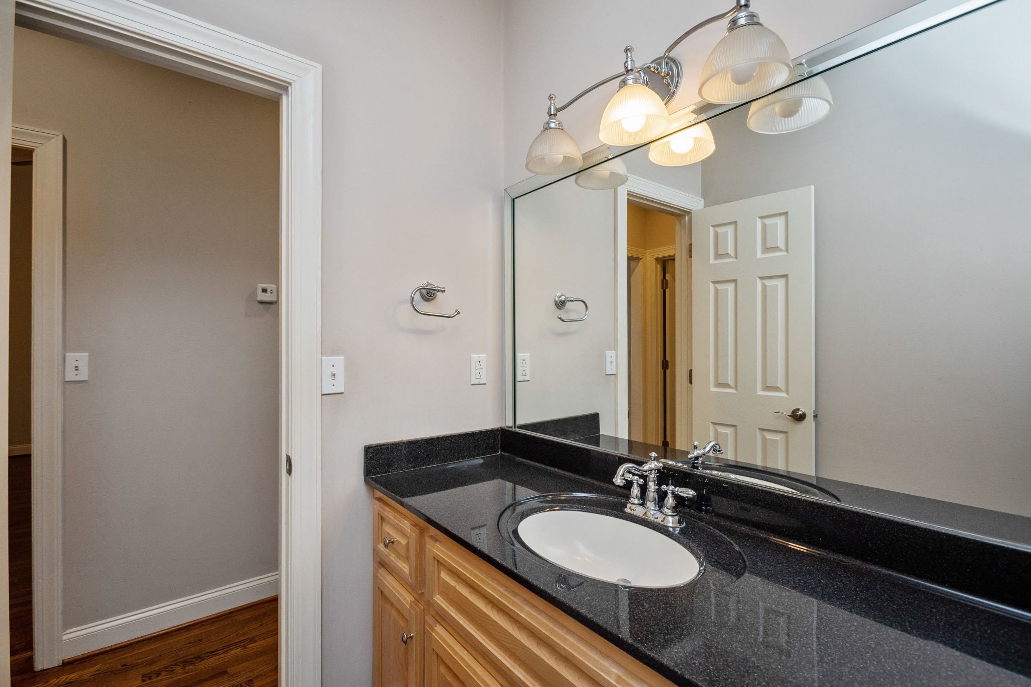 2399 Jack Teasley Road Pleasant View, TN 37146 - Photo 22 of 48 a bathroom with a granite countertop sink and a mirror